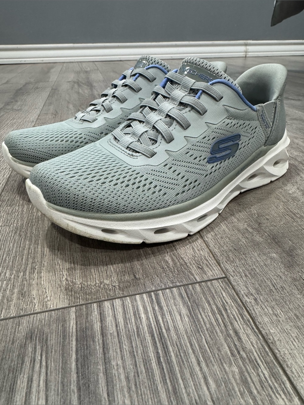 Skechers women’s Light Gray and Blue Athletic Slip-On Sneakers